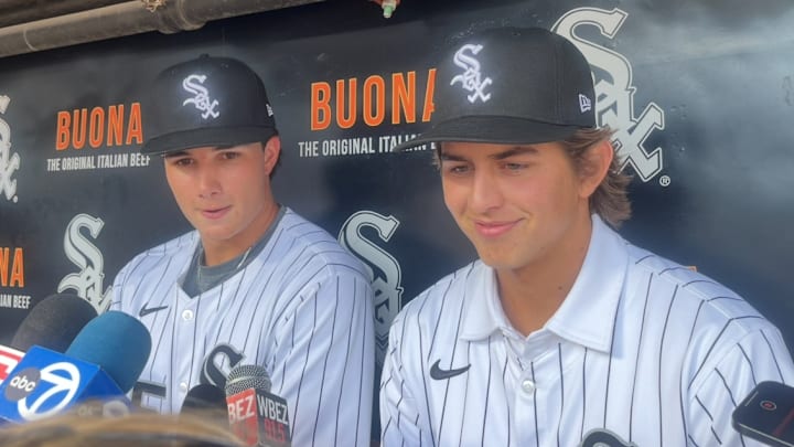 Chicago White Sox prospects Billy Carlson (right) and Jaden Fauske (left) talk before Tuesday's game at Rate Field.