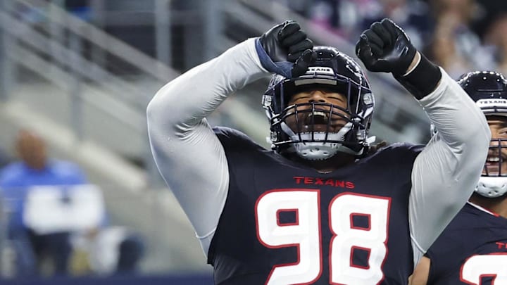 Nov 18, 2024; Arlington, Texas, USA; Houston Texans defensive tackle Tim Settle Jr. (98) reacts after a sack during the second half against the Dallas Cowboys at AT&T Stadium. Mandatory Credit: Kevin Jairaj-Imagn Images
