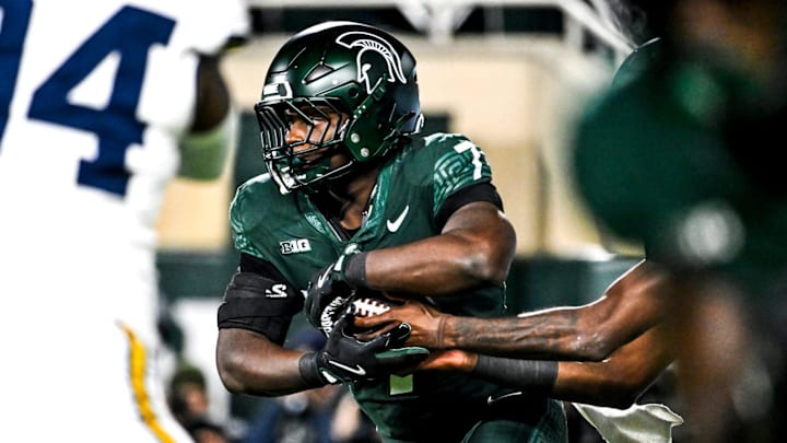 Michigan State's Brandon Tullis runs the ball against Michigan during the third quarter on Saturday, Oct. 25, 2025, at Spartan Stadium in East Lansing. Michigan State's Brandon Tullis runs the ball against Michigan during the third quarter on Saturday, Oct. 25, 2025, at Spartan Stadium in East Lansing.