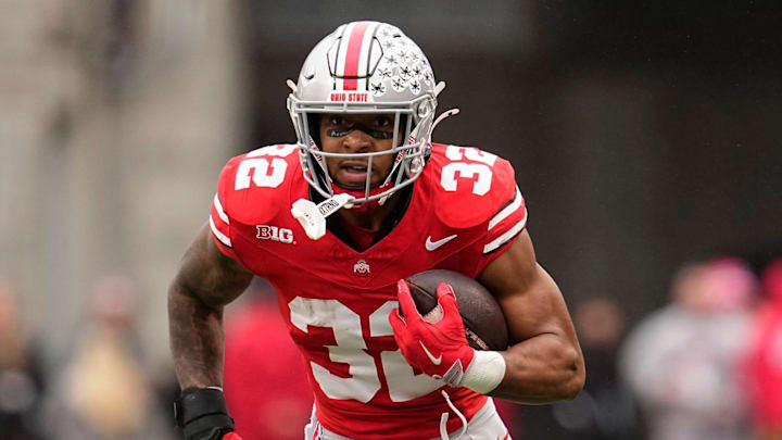 Ohio State Buckeyes running back TreVeyon Henderson (32) runs upfield during the NCAA football game against the Indiana Hoosiers at Ohio Stadium in Columbus on Monday, Nov. 25, 2024. Ohio State won 38-15. Ohio State Buckeyes running back TreVeyon Henderson (32) runs upfield during the NCAA football game against the Indiana Hoosiers at Ohio Stadium in Columbus on Monday, Nov. 25, 2024. Ohio State won 38-15.