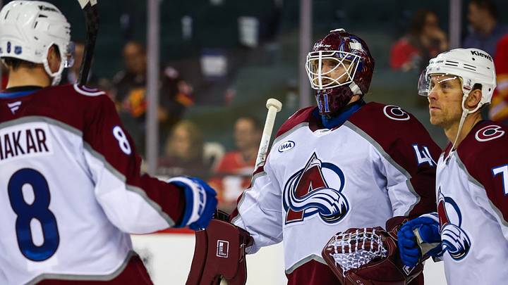 Oct 8, 2026; Calgary, Alberta, CAN; Colorado Avalanche goaltender Scott Wedgewood (41) celebrates win with teammates after defeating the Calgary Flames at Scotiabank Saddledome. Mandatory Credit: Sergei Belski-Imagn Images