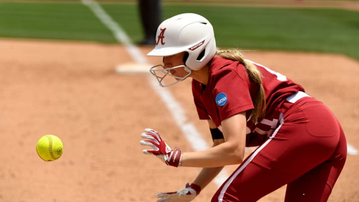 May 18 2024; Tuscaloosa, AL, USA; Alabama batter Larissa Preuitt (11) eyes a bunt she has just dropped as she takes off for first base during the Tuscaloosa Regional at Rhoads Stadium. Alabama defeated Southeast Louisiana 6-3 in 9 innings.