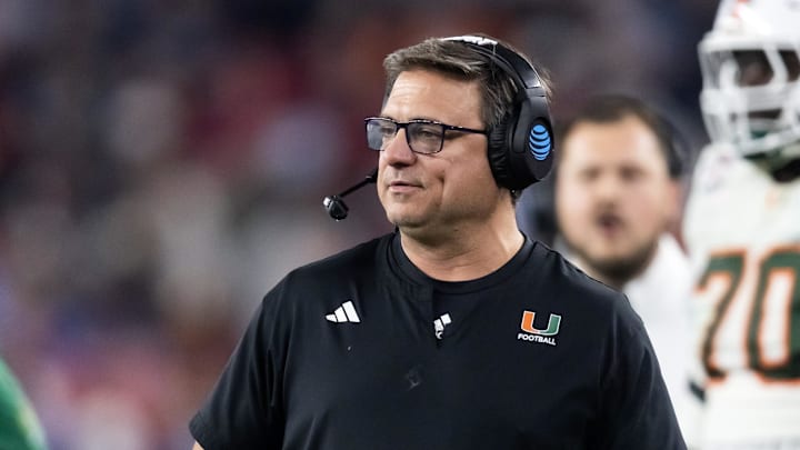 Jan 8, 2026; Glendale, AZ, USA; Miami Hurricanes offensive coordinator Shannon Dawson against the Mississippi Rebels during the 2026 Fiesta Bowl and semifinal game of the College Football Playoff at State Farm Stadium. Mandatory Credit: Mark J. Rebilas-Imagn Images