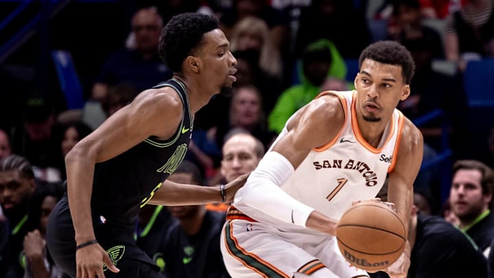 Apr 5, 2024; New Orleans, Louisiana, USA; San Antonio Spurs center Victor Wembanyama (1) passes the ball against New Orleans Pelicans forward Herbert Jones (5) during the first half at Smoothie King Center. Mandatory Credit: Stephen Lew-Imagn Images Apr 5, 2024; New Orleans, Louisiana, USA; San Antonio Spurs center Victor Wembanyama (1) passes the ball against New Orleans Pelicans forward Herbert Jones (5) during the first half at Smoothie King Center. Mandatory Credit: Stephen Lew-Imagn Images