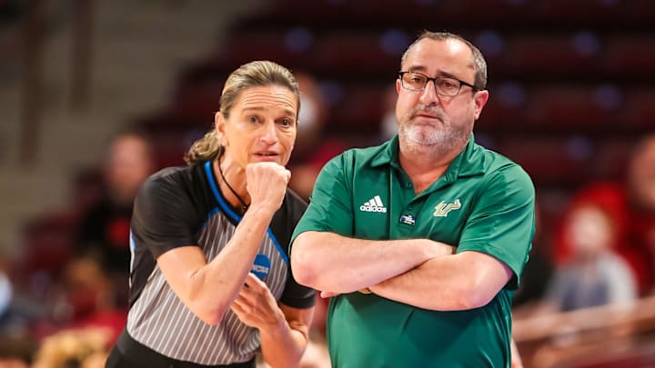 Mar 18, 2022; Columbia, South Carolina, USA; South Florida Bulls head coach Jose Fernandez disputes a call against the Miami Hurricanes in the second quarter at Colonial Life Arena. Mandatory Credit: Jeff Blake-Imagn Images Mar 18, 2022; Columbia, South Carolina, USA; South Florida Bulls head coach Jose Fernandez disputes a call against the Miami Hurricanes in the second quarter at Colonial Life Arena. Mandatory Credit: Jeff Blake-Imagn Images