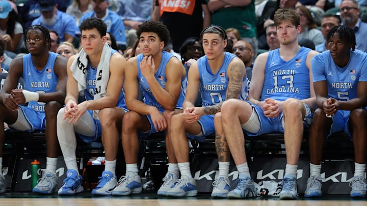Feb 10, 2026; Coral Gables, Florida, USA; North Carolina Tar Heels basketball players watch from the bench against the Miami Hurricanes during the second half at Watsco Center. Mandatory Credit: Sam Navarro-Imagn Images