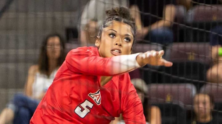 Arizona Wildcats women's volleyball outside hitter Jordan Wilson (5) hits the ball against the Arizona State Sun Devils at Mullett Arena in Tempe on Sept. 21, 2023.