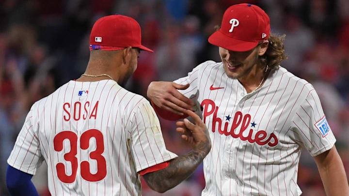 May 27, 2025; Philadelphia, Pennsylvania, USA; Philadelphia Phillies second base Edmundo Sosa (33) and third base Alec Bohm (28) celebrate win against the Atlanta Braves at Citizens Bank Park.
