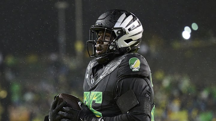 Oct 25, 2025; Eugene, Oregon, USA; Oregon Ducks offensive tackle Gernorris Wilson (35) catches a touchdown pass during the second half against the Wisconsin Badgers at Autzen Stadium. Mandatory Credit: Troy Wayrynen-Imagn Images