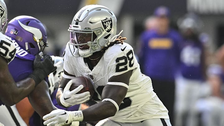 Aug 10, 2024; Minneapolis, Minnesota, USA; Las Vegas Raiders running back Sincere McCormick (28) runs the ball against the Minnesota Vikings as offensive tackle Jalen McKenzie (54) blocks during the game at U.S. Bank Stadium. Mandatory Credit: Jeffrey Becker-Imagn Images Aug 10, 2024; Minneapolis, Minnesota, USA; Las Vegas Raiders running back Sincere McCormick (28) runs the ball against the Minnesota Vikings as offensive tackle Jalen McKenzie (54) blocks during the game at U.S. Bank Stadium. Mandatory Credit: Jeffrey Becker-Imagn Images