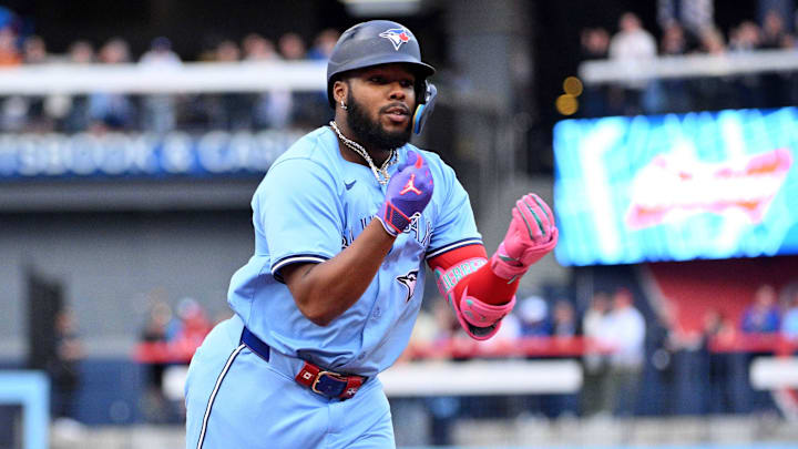 Aug 19, 2024; Toronto, Ontario, CAN; Toronto Blue Jays designated hitter Vladimir Guererro Jr. (27) gestures toward teammates after hitting a solo home run against the Cincinnati Reds in the first inning at Rogers Centre. Aug 19, 2024; Toronto, Ontario, CAN; Toronto Blue Jays designated hitter Vladimir Guererro Jr. (27) gestures toward teammates after hitting a solo home run against the Cincinnati Reds in the first inning at Rogers Centre.
