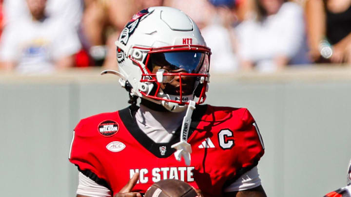 Oct 4, 2025; Raleigh, North Carolina, USA;  NC State Wolfpack quarterback CJ Bailey (11) looks to pass during the first half of the game against Campbell Fighting Camels at Carter-Finley Stadium. Mandatory Credit: Jaylynn Nash-Imagn Images