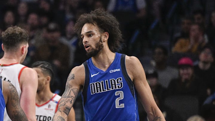 Jan 9, 2025; Dallas, Texas, USA; Dallas Mavericks guard Jaden Hardy (1) and center Dereck Lively II (2) celebrate during the second quarter against the Portland Trail Blazers at the American Airlines Center. Mandatory Credit: Jerome Miron-Imagn Images