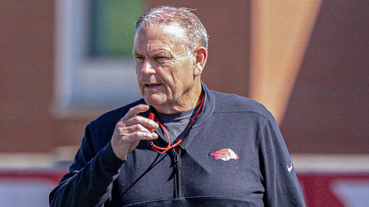 Arkansas Razorbacks coach Sam Pittman watching spring practice drills on the outdoor fields in Fayetteville, Ark.