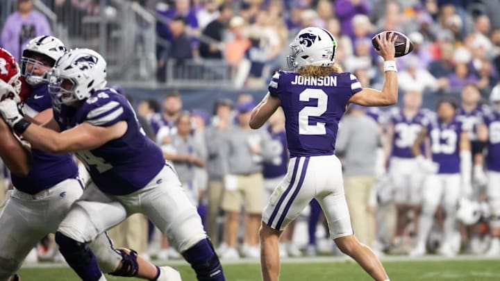 Dec 26, 2024; Phoenix, AZ, USA; Kansas State Wildcats quarterback Avery Johnson (2) against the Rutgers Scarlet Knights during the Rate Bowl at Chase Field. Mandatory Credit: Mark J. Rebilas-Imagn Images
