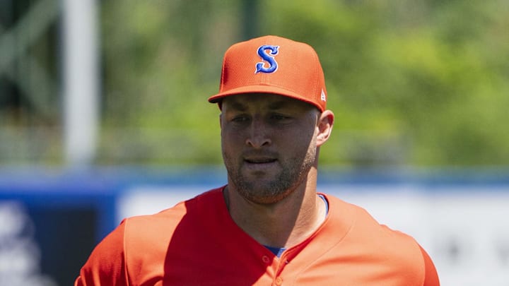 Syracuse Mets left fielder Tim Tebow (15) warms up on the field prior to the game against the Buffalo Bisons at NBT Bank Stadium. Syracuse Mets left fielder Tim Tebow (15) warms up on the field prior to the game against the Buffalo Bisons at NBT Bank Stadium.