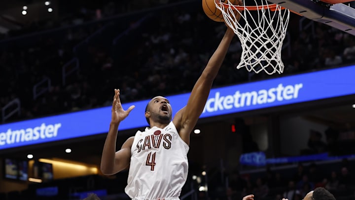 Dec 12, 2025; Washington, District of Columbia, USA; Cleveland Cavaliers center Evan Mobley (4) shoots the ball over Washington Wizards guard CJ McCollum (3) and Wizards forward Marvin Bagley III (35) in the second half at Capital One Arena. Mandatory Credit: Geoff Burke-Imagn Images Dec 12, 2025; Washington, District of Columbia, USA; Cleveland Cavaliers center Evan Mobley (4) shoots the ball over Washington Wizards guard CJ McCollum (3) and Wizards forward Marvin Bagley III (35) in the second half at Capital One Arena. Mandatory Credit: Geoff Burke-Imagn Images