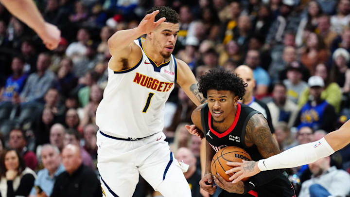 Dec 8, 2023; Denver, Colorado, USA; Denver Nuggets forward Michael Porter Jr. (1) and forward Aaron Gordon (50) defend on Houston Rockets guard Jalen Green (4) during the second quarter at Ball Arena. Mandatory Credit: Ron Chenoy-Imagn Images.