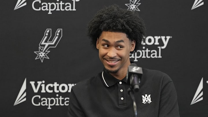 Jun 28, 2025; San Antonio, TX, USA; San Antonio first round draft pick Dylan Harper (2) reacts to a question from the media during a press conference at Victory Capital Performance Center.