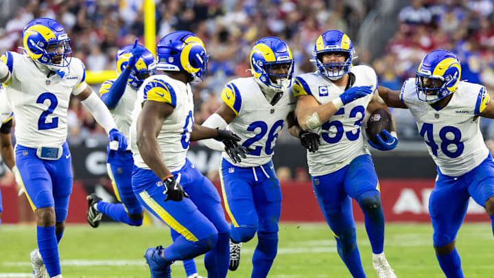 Dec 7, 2025; Glendale, Arizona, USA; Los Angeles Rams linebacker Nate Landman (53) celebrates an interception with Jaylen McCollough (2), Byron Young (0), Kamren Kinchens (26) and Omar Speights (48) against the Arizona Cardinals at State Farm Stadium. Mandatory Credit: Mark J. Rebilas-Imagn Images Dec 7, 2025; Glendale, Arizona, USA; Los Angeles Rams linebacker Nate Landman (53) celebrates an interception with Jaylen McCollough (2), Byron Young (0), Kamren Kinchens (26) and Omar Speights (48) against the Arizona Cardinals at State Farm Stadium. Mandatory Credit: Mark J. Rebilas-Imagn Images