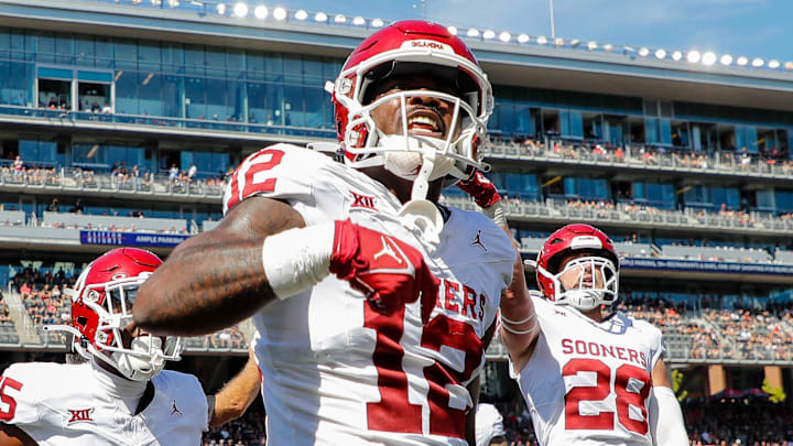 Sep 23, 2023; Cincinnati, Ohio, USA; Oklahoma Sooners defensive back Key Lawrence (12) reacts after intercepting the ball during the first half against the Cincinnati Bearcats at Nippert Stadium. Mandatory Credit: Katie Stratman-Imagn Images Sep 23, 2023; Cincinnati, Ohio, USA; Oklahoma Sooners defensive back Key Lawrence (12) reacts after intercepting the ball during the first half against the Cincinnati Bearcats at Nippert Stadium. Mandatory Credit: Katie Stratman-Imagn Images