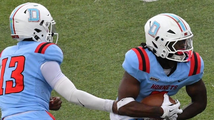 Hornet quarterback Jayden Sauray hands off to Marquis Gillis in Saturday's game with Howard University on November 15, 2025. Hornet quarterback Jayden Sauray hands off to Marquis Gillis in Saturday's game with Howard University on November 15, 2025.