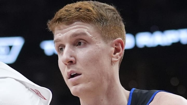Feb 11, 2026; Toronto, Ontario, CAN; Toronto Raptors guard Ja'Kobe Walter (14) controls the ball against Detroit Pistons guard Kevin Huerter (27): John E. Sokolowski-Imagn Images