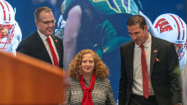 New Wisconsin head football coach Luke Fickell, right, joins  athletic director Chris McIntosh, left, and Chancellor Jennifer Mnookin at a welcome event Monday, November 28, 2022. at Camp Randall Stadium in Madison, Wis. 
