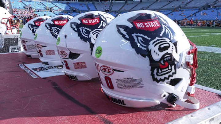 Sep 7, 2024; Charlotte, North Carolina, USA; North Carolina State Wolfpack helmets during pregame activity for the Dukes Mayo Classic against the Tennessee Volunteers at Bank of America Stadium. Mandatory Credit: Jim Dedmon-Imagn Images Sep 7, 2024; Charlotte, North Carolina, USA; North Carolina State Wolfpack helmets during pregame activity for the Dukes Mayo Classic against the Tennessee Volunteers at Bank of America Stadium. Mandatory Credit: Jim Dedmon-Imagn Images