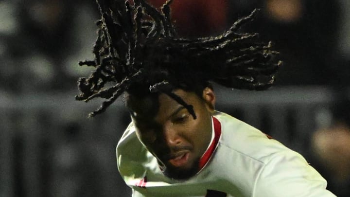 Dec 12, 2025; Cary, NC, USA; NC State Wolfpack forward Donavan Phillip (7) with the ball as Saint Louis Billikens defender JC Cortez (5) and midfielder Drake Fournier (19) defend in the second half at First Horizon Stadium. Mandatory Credit: Bob Donnan-Imagn Images
