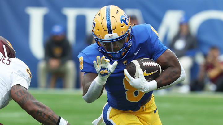 Sep 6, 2025; Pittsburgh, Pennsylvania, USA;  Pittsburgh Panthers running back Juelz Goff (8) runs the ball as Central Michigan Chippewas defensive back Brenden Deasfernandes (3) chases during the first quarter at Acrisure Stadium. Mandatory Credit: Charles LeClaire-Imagn Images