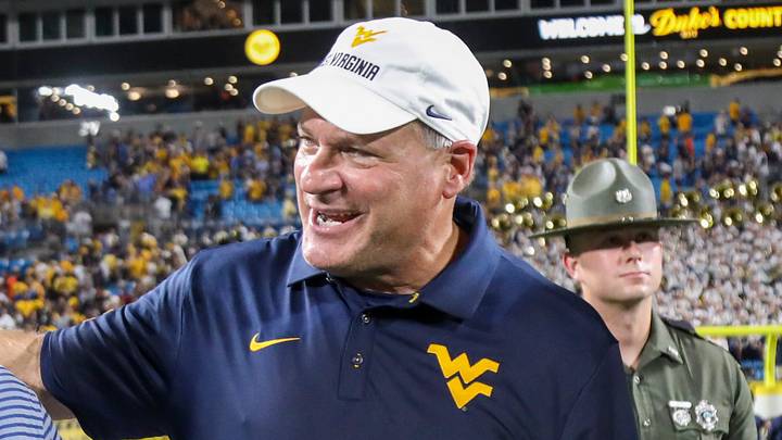 Sep 19, 2026; Charlotte, North Carolina, USA; West Virginia University President Michael Benson celebrates with West Virginia Mountaineers head coach Rich Rodriguez after defeating the Virginia Cavaliers at Bank of America Stadium. Mandatory Credit: Ben Queen-Imagn Images