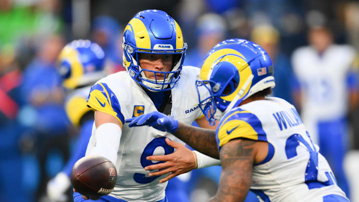 Nov 3, 2024; Seattle, Washington, USA; Los Angeles Rams quarterback Matthew Stafford (9) hands the ball off to running back Kyren Williams (23) during the second half against the Seattle Seahawks at Lumen Field. Mandatory Credit: Steven Bisig-Imagn Images Nov 3, 2024; Seattle, Washington, USA; Los Angeles Rams quarterback Matthew Stafford (9) hands the ball off to running back Kyren Williams (23) during the second half against the Seattle Seahawks at Lumen Field. Mandatory Credit: Steven Bisig-Imagn Images