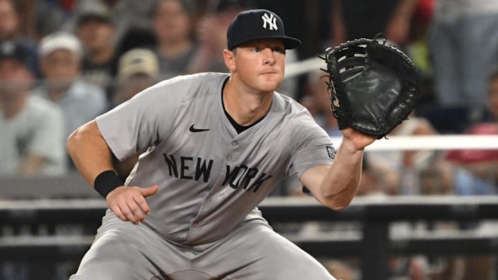 Aug 27, 2024; Washington, District of Columbia, USA; New York Yankees third baseman DJ LeMahieu (26) fields the ball at first base against the Washington Nationals during the sixth inning at Nationals Park