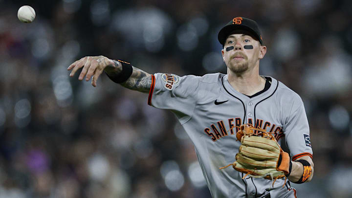 Jun 27, 2025; Chicago, Illinois, USA; San Francisco Giants third baseman Christian Koss (50) throws to first base for an out against the Chicago White Sox during the seventh inning at Rate Field.