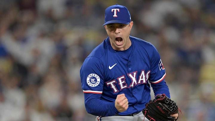 Jun 13, 2024; Los Angeles, California, USA;  Texas Rangers relief pitcher David Robertson (37) reacts after striking out Los Angeles Dodgers shortstop Mookie Betts (50), designated hitter Shohei Ohtani (17) and first baseman Freddie Freeman (5) in the eighth inning at Dodger Stadium. Mandatory Credit: Jayne Kamin-Oncea-USA TODAY Sports