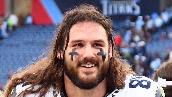 Former Seattle Seahawks tight end Colby Parkinson celebrates as he leaves the field