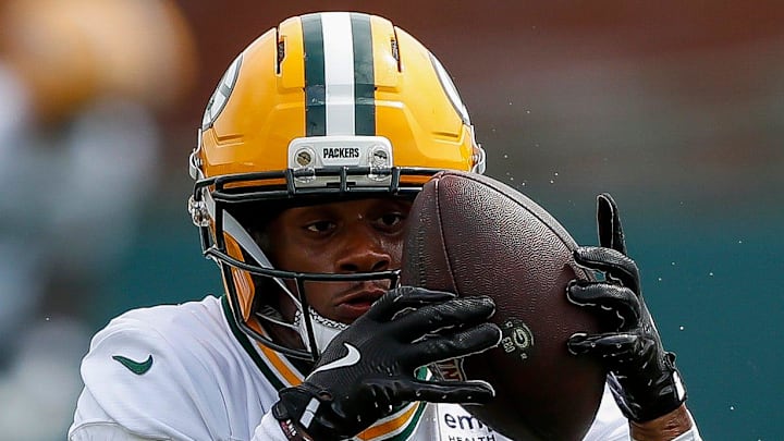 Green Bay Packers running back MarShawn Lloyd (32) catches a toss at training camp. Green Bay Packers running back MarShawn Lloyd (32) catches a toss at training camp.