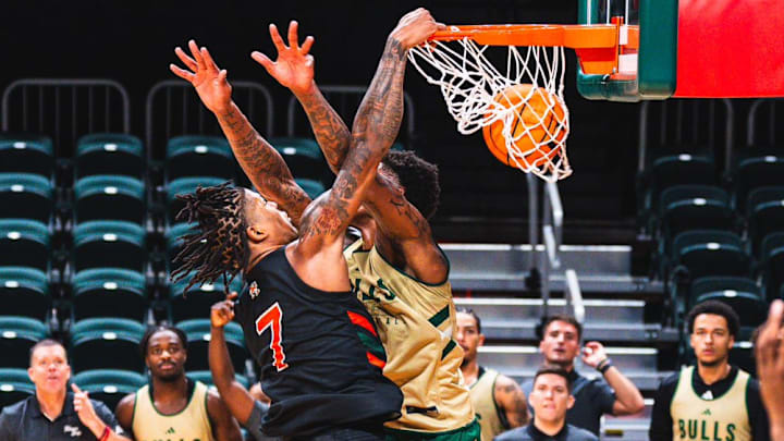 MIami Freshman Shelton Henderson Dunking on USF player in scrimmage. MIami Freshman Shelton Henderson Dunking on USF player in scrimmage.