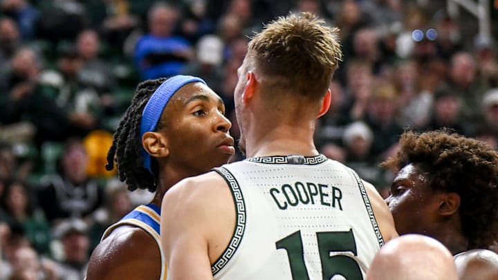 Michigan State's Carson Cooper, right, and UCLA's Steven Jamerson, left, stare each other down after Jamerson's flagrant foul on Cooper during the second half on Tuesday, Feb. 17, 2026, at the Breslin Center in East Lansing. Michigan State's Carson Cooper, right, and UCLA's Steven Jamerson, left, stare each other down after Jamerson's flagrant foul on Cooper during the second half on Tuesday, Feb. 17, 2026, at the Breslin Center in East Lansing.
