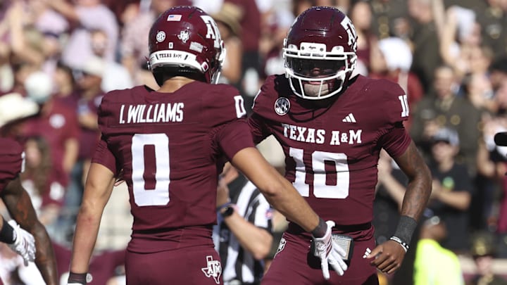 Texas A&M Aggies quarterback Marcel Reed celebrates with wide receiver Izaiah Williams after an Aggies touchdown during the third quarter against the South Carolina Gamecocks at Kyle Field. Texas A&M Aggies quarterback Marcel Reed celebrates with wide receiver Izaiah Williams after an Aggies touchdown during the third quarter against the South Carolina Gamecocks at Kyle Field.