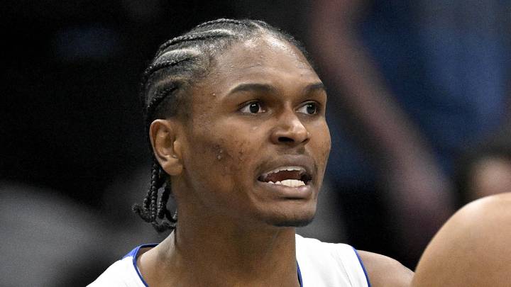 Detroit Pistons guard Ausar Thompson (9) is restrained by forward Tobias Harris (12) as Thompson reacts to being thrown out of the game against the Dallas Mavericks by NBA referee John Goble (not pictured) during the second quarter at the American Airlines Center on Dec 18, 2025.