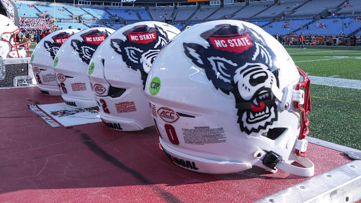 Sep 7, 2024; Charlotte, North Carolina, USA; North Carolina State Wolfpack helmets during pregame activity for the Dukes Mayo Classic against the Tennessee Volunteers at Bank of America Stadium. Mandatory Credit: Jim Dedmon-Imagn Images