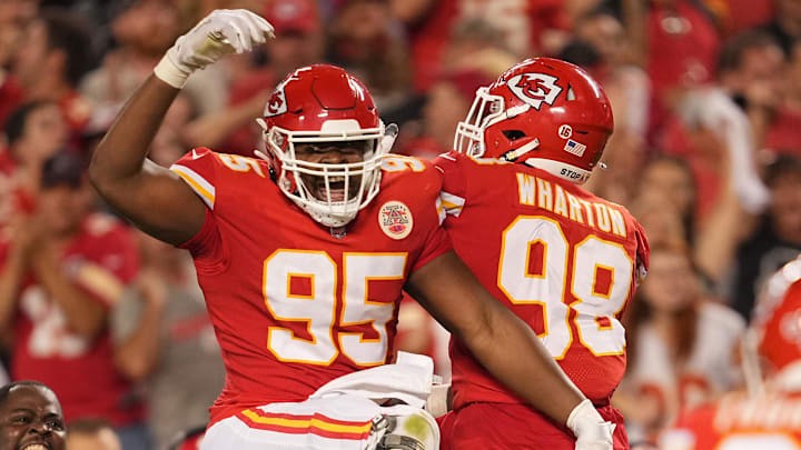 Sep 15, 2022; Kansas City, Missouri, USA; Kansas City Chiefs defensive tackle Chris Jones (95) celebrates after sacking Los Angeles Chargers quarterback Justin Herbert (10) with defensive tackle Tershawn Wharton (98) during the second half at GEHA Field at Arrowhead Stadium. Mandatory Credit: Jay Biggerstaff-Imagn Images