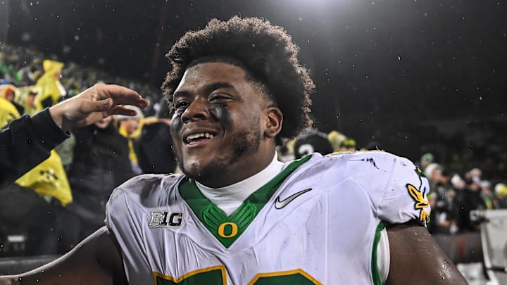 Nov 8, 2025; Iowa City, Iowa, USA; Oregon Ducks defensive lineman A'Mauri Washington (52) reacts with fans after the game against the Iowa Hawkeyes at Kinnick Stadium. Mandatory Credit: Jeffrey Becker-Imagn Images