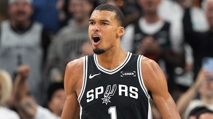 May 12, 2026; San Antonio, Texas, USA; San Antonio Spurs forward Victor Wembanyama and guard Devin Vassell (24) react during the first half of game five of the second round of the 2026 NBA Playoffs against the Minnesota Timberwolves at Frost Bank Center. Mandatory Credit: Scott Wachter-Imagn Images