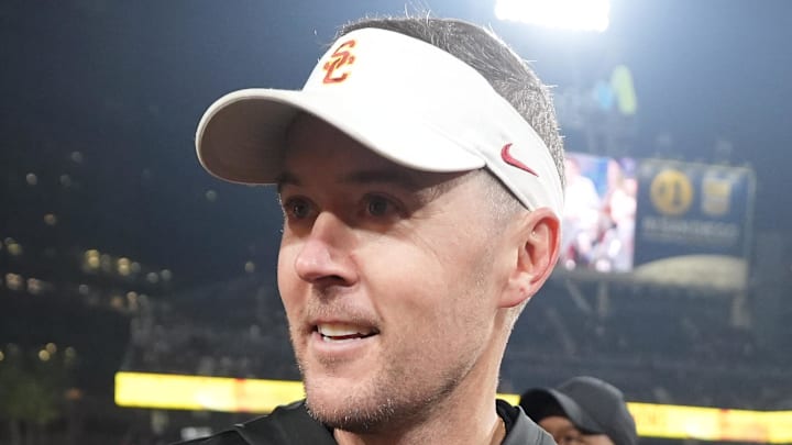 Dec 27, 2023; San Diego, CA, USA; Southern California Trojans coach Lincoln Riley embraces daughters Sloane Riley and Stella Riley after the Holiday Bowl against the Louisville Cardinals at Petco Park. Mandatory Credit: Kirby Lee-Imagn Images