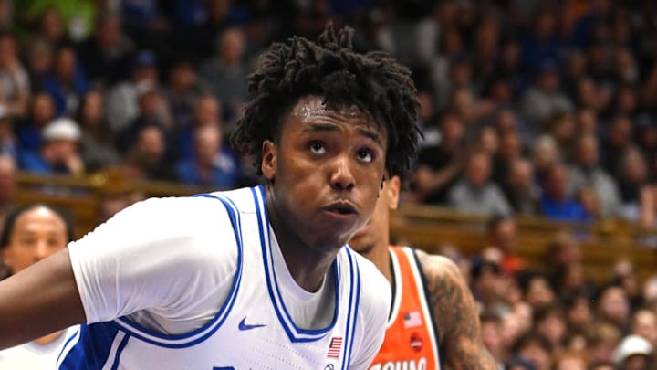 Feb 16, 2026; Durham, North Carolina, USA;  Duke Blue Devils center Patrick Ngongba II (21) brings the ball around Syracuse Orange forward William Kyle (42) during the during the second half at Cameron Indoor Stadium. Mandatory Credit: Zachary Taft-Imagn Images