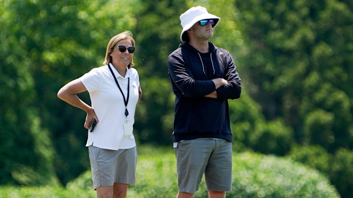 Katie Blackburn, left, and Duke Tobin, right, watch the Cincinnati Bengals practice, Wednesday, June 11, 2025, at Kettering Health Practice Fields in Downtown Cincinnati.