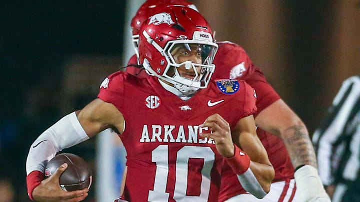 Arkansas Razorbacks quarterback Taylen Green (10) runs the ball for a first down as Texas Tech Red Raiders linebacker Charles Esters III (11) pursues during the second quarter at Simmons Bank Liberty Stadium.